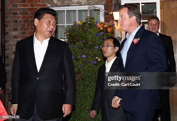 Prime Minister David Cameron leaves The Plough pub with China's president Xi Jinping on October 22, 2015 in Princes Risborough, England. The...