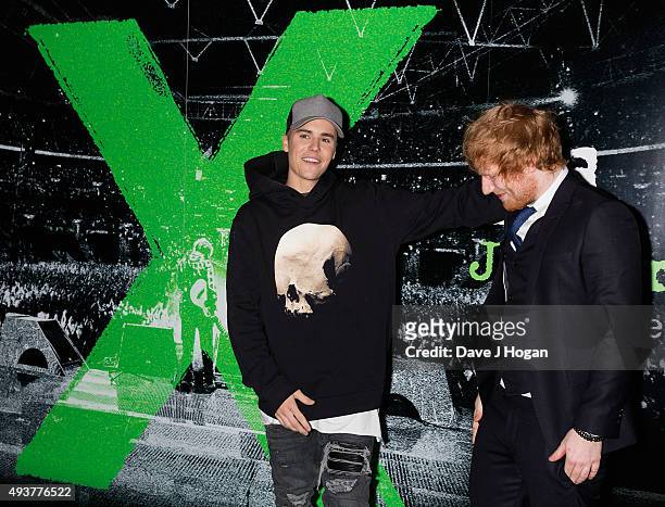 Justin Bieber poses with Ed Sheeran at the World Premiere of "Jumpers For Goalposts" at Odeon Leicester Square on October 22, 2015 in London, England.
