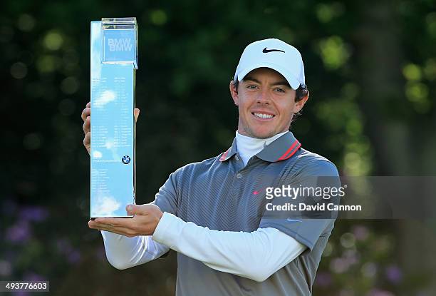 Rory McIlroy of Northern Ireland poses with the trophy following his victory at the end of day four of the BMW PGA Championship at Wentworth on May...