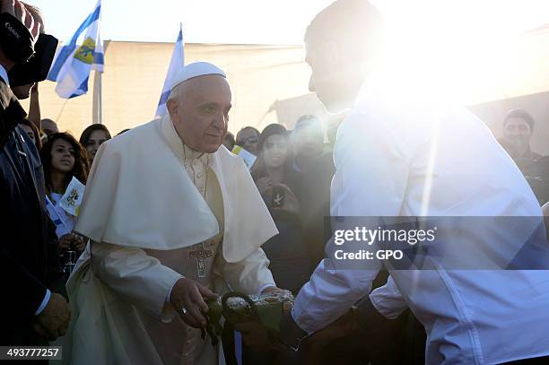 In this handout provided by the Israeli Government Press Office , Pope Francis is greeted by worshipers as he arrives at Mount Scopus on May 25, 2014...