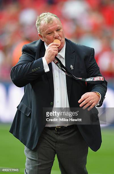 Rotherham manager Steve Evans kisses his medal after the Sky Bet League One Playoff Final between Leyton Orient and Rotherham United at Wembley...