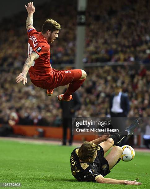 Alberto Moreno of Liverpool is tackled by Oleg Kuzmin of Rubin Kazan during the UEFA Europa League Group B match between Liverpool FC and Rubin Kazan...