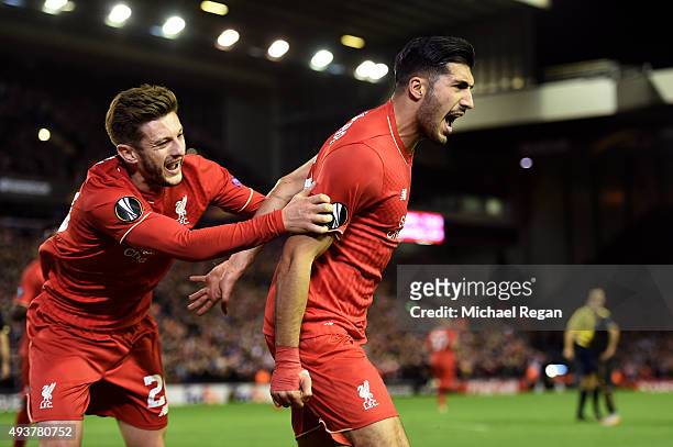 Emre Can of Liverpool is congratulated by teammate Adam Lallana of Liverpool after scoring a goal to level the scores at 1-1 during the UEFA Europa...