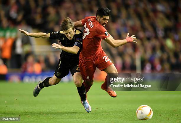 Oleg Kuzmin of Rubin Kazan brings down Emre Can of Liverpool to earn his second booking and red card during the UEFA Europa League Group B match...