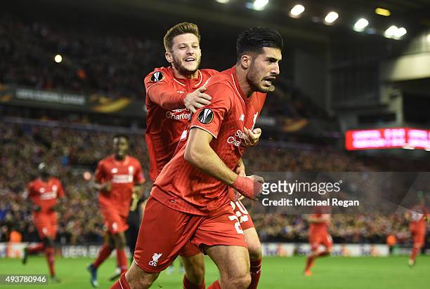 Emre Can of Liverpool is congratulated by teammate Adam Lallana of Liverpool after scoring a goal to level the scores at 1-1 during the UEFA Europa...