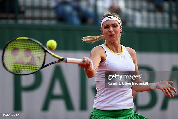 Maria Kirilenko of Russia returns a shot during her women's singles match against Johanna Larsson of Sweden on day one of the French Open at Roland...