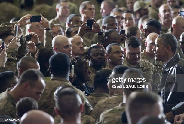 President Barack Obama greets US troops during a surprise visit to Bagram Air Field, north of Kabul, in Afghanistan, May 25 prior to the Memorial Day...