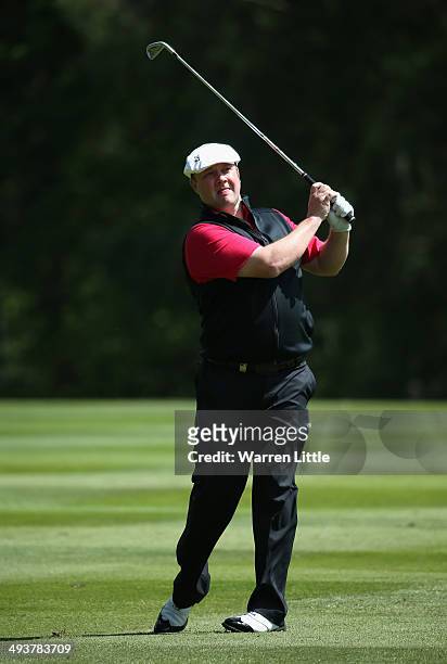 Chris Doak of Scotland hits an approach during day four of the BMW PGA Championship at Wentworth on May 25, 2014 in Virginia Water, England.