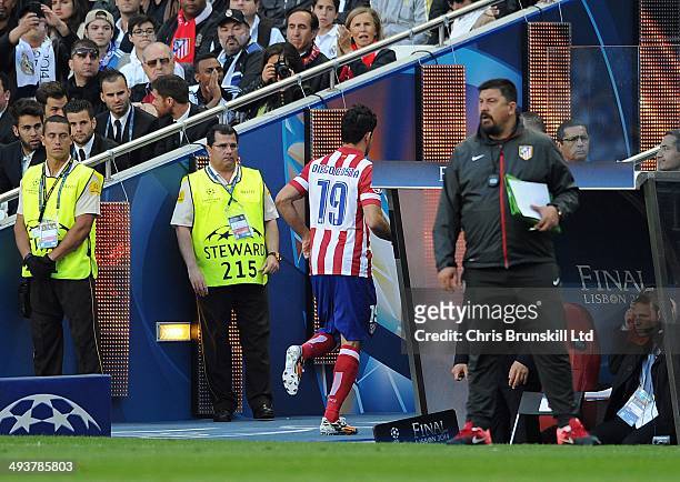 Diego Costa of Atletico de Madrid leaves the field through injury during the UEFA Champions League Final match between Real Madrid and Atletico de...