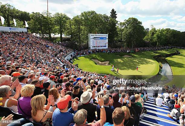 Rory McIlroy of Northern Ireland celebrates after putting for birdie on the 18th green during day four of the BMW PGA Championship at Wentworth on...