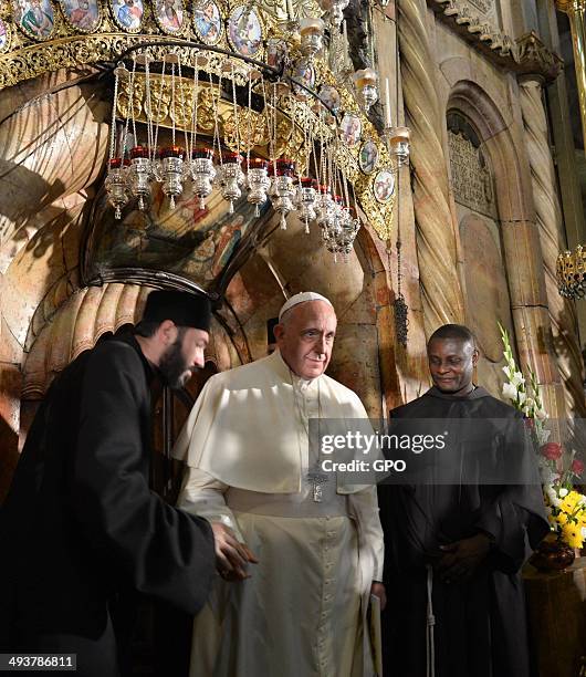 In this handout provided by the Israeli Government Press Office , Pope Francis prays at the Church of the Holy Sepulchre on May 25, 2014 in...