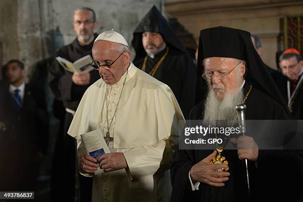 In this handout provided by the Israeli Government Press Office , Pope Francis prays at the Church of the Holy Sepulchre on May 25, 2014 in...