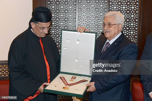 Bechara Boutros al-Rahi, 77th Maronite Patriarch of Antioch meets with the Palestinian President Mahmoud Abbas in Ramallah on May 25, 2014.
