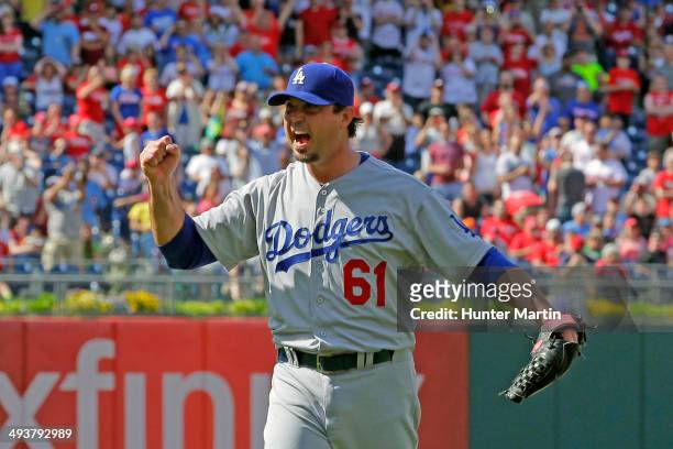 Starting pitcher Josh Beckett of the Los Angeles Dodgers celebrates in the ninth inning after recording a no hitter during a game against the...