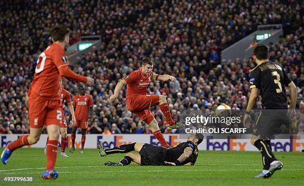 Liverpool's English midfielder and captain James Milner kicks the ball during a UEFA Europa League group B football match between Liverpool FC and FC...