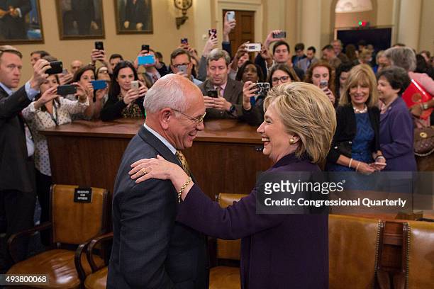 Democratic presidential candidate and former Secretary of State Hillary Rodham Clinton, greets Rep. Paul Tonko, D-N.Y., after testifying before the...