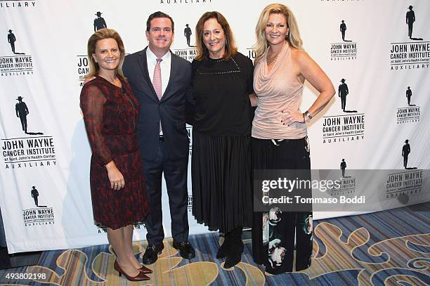 Melanie Wayne, Michael Wayne, John Wayne Cancer Institute Auxiliary President Anita Swift and actress Marisa Wayne attend the John Wayne Cancer...