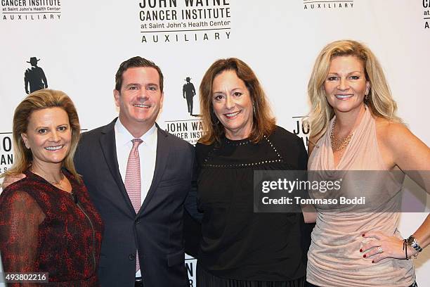 Melanie Wayne, Michael Wayne, John Wayne Cancer Institute Auxiliary President Anita Swift and actress Marisa Wayne attend the John Wayne Cancer...