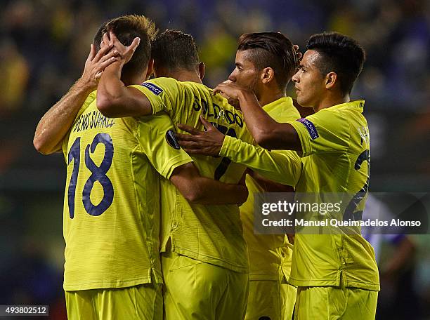 Roberto Soldado of Villarreal celebrates scoring his team's third goal with his teammates during the UEFA Europa League Group K match between...