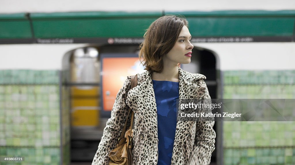 Young woman waiting at subway station