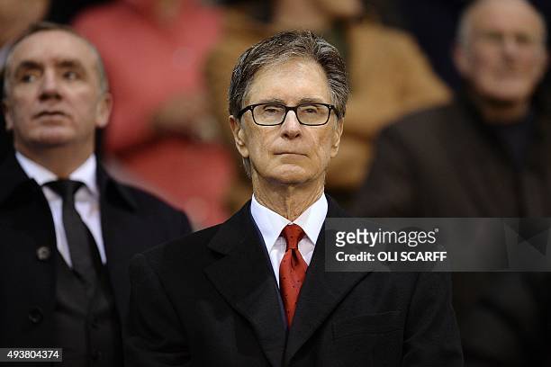 Liverpool's US owner John W Henry looks on before a UEFA Europa League group B football match between Liverpool FC and FC Rubin Kazan at Anfield in...