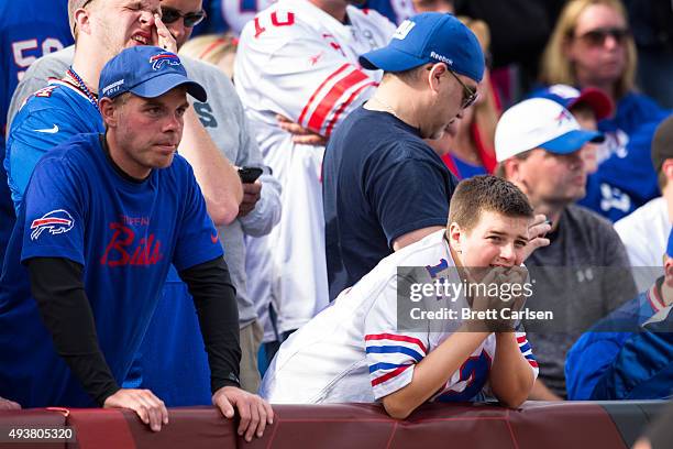 Buffalo Bills fans watch game action as their team trails to the New York Giants on October 4, 2015 at Ralph Wilson Stadium in Orchard Park, New...