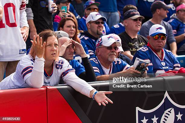 Buffalo Bills fans watch game action as their team trails to the New York Giants on October 4, 2015 at Ralph Wilson Stadium in Orchard Park, New...