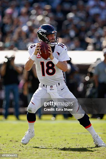 Peyton Manning of the Denver Broncos in action against the Oakland Raiders at O.co Coliseum on October 11, 2015 in Oakland, California.