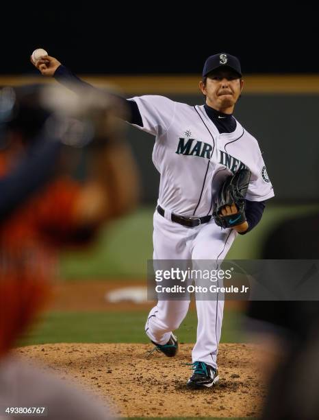 Starter Hisashi Iwakuma of the Seattle Mariners pitches in the third inning against the Houston Astros at Safeco Field on May 25, 2014 in Seattle,...