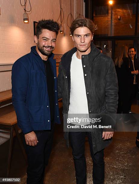 Dominic Cooper and Oliver Cheshire attend Whistles Men 1st birthday celebrations at Protein Galleries on October 22, 2015 in London, England.