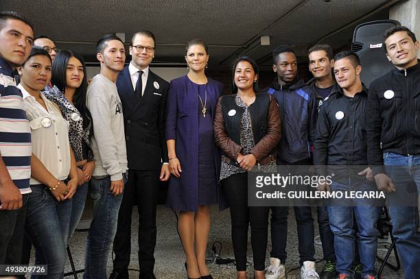 Crown Princess Victoria and Prince Daniel of Sweden pose with youngsters during a visit the Ruta Motor project, a social program sponsored by the...