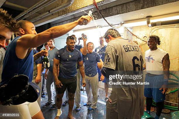 Starting pitcher Josh Beckett of the Los Angeles Dodgers is sprayed by teammates outside of the clubhouse after throwing a no-hitter against the...
