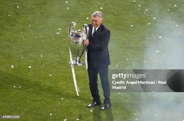 Head coach Carlo Ancelotti celebrates during the Real Madrid celebration the day after winning the UEFA Champions League Final at Santiago Bernabeu...