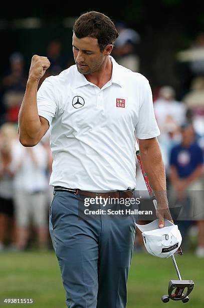 Adam Scott of Australia celebrates a birdie putt on the third playoff hole to defeat Jason Dufner and win the 18th hole during the Final Round of the...