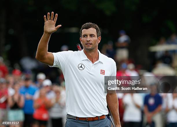 Adam Scott of Australia celebrates a birdie putt on the third playoff hole to defeat Jason Dufner and win the 18th hole during the Final Round of the...