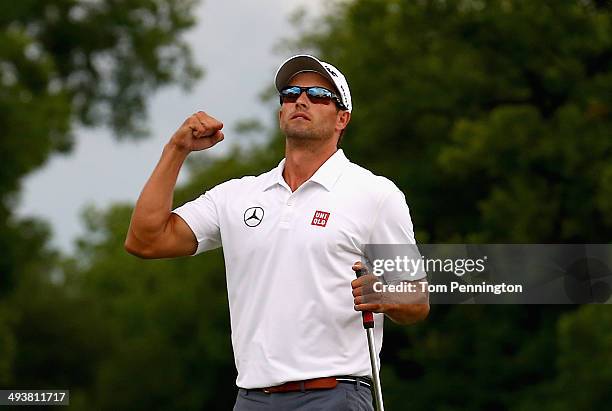 Adam Scott of Australia celebrates a birdie putt on the third playoff hole to defeat Jason Dufner on the 18th hole during the Final Round of the...