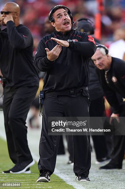 Head coach Jim Tomsula of the San Francisco 49ers signals from the sidelines during their NFL game against the Seattle Seahawks at Levi's Stadium on...