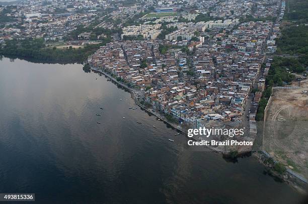 Aerial view of Guanabara bay at the border of Favela da Maré , water pollution, Rio de Janeiro.