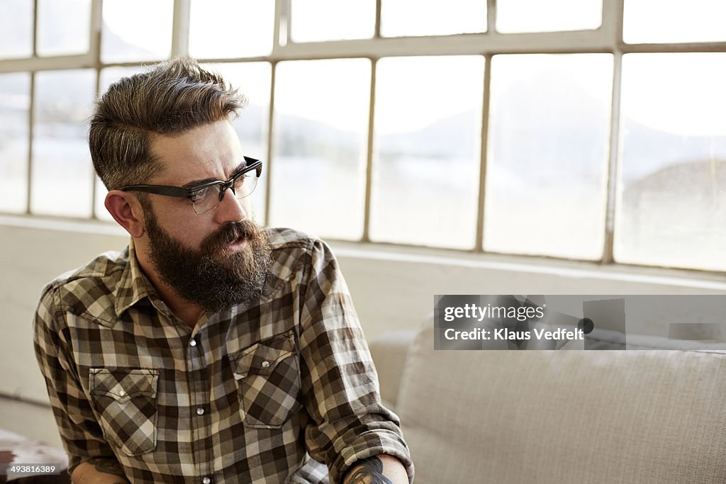 Portrait of creative businessman at meeting