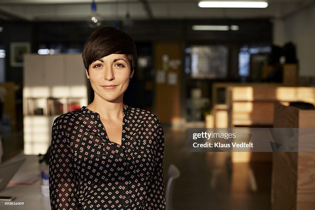 Portrait of cool creative businesswoman at office