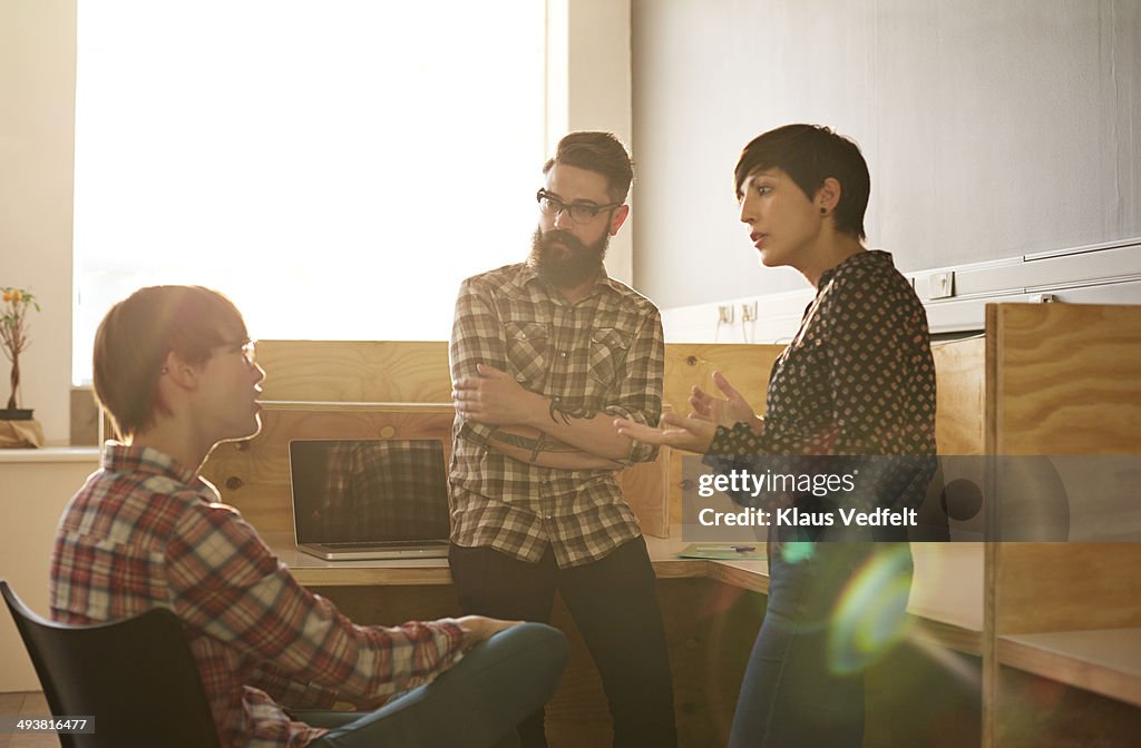 Creative coworkers having casual meeting