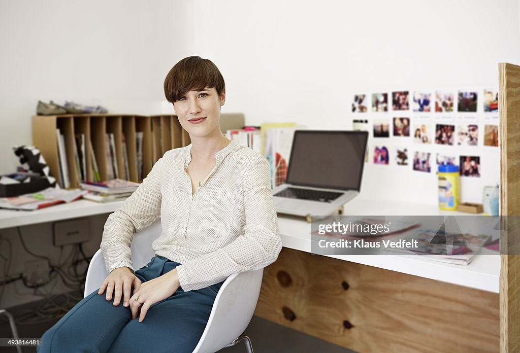 Portrait of cool creative businesswoman at desk