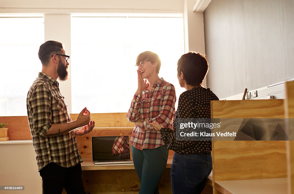 Creative coworkers having casual meeting at office