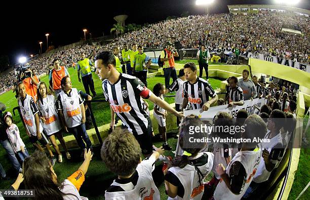 Players of Atletico MG enter the field before a match between Atletico MG and Criciuma as part of Brasileirao Series A 2014 at Joao Lamego Stadium on...