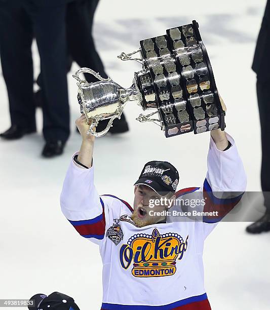 Henrik Samuelsson of the Edmonton Oil Kings skates with the Memorial Cup trophy following a 6-3 victory over the Guelph Storm in the 2014 Memorial...