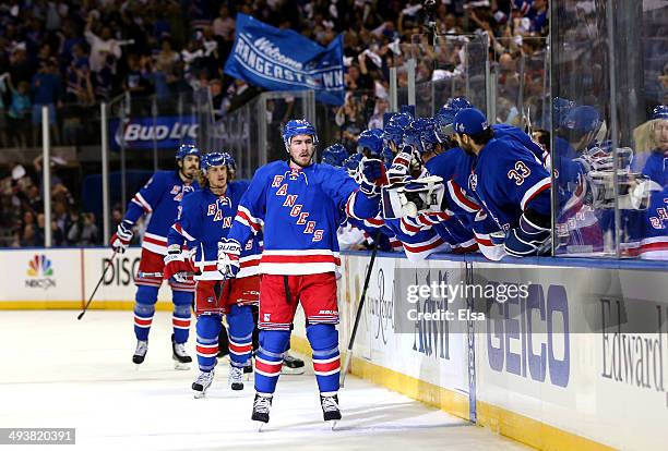 Ryan McDonagh and Carl Hagelin of the New York Rangers celebrate after Hagelin scored a goal against Dustin Tokarski of the Montreal Canadiens in the...