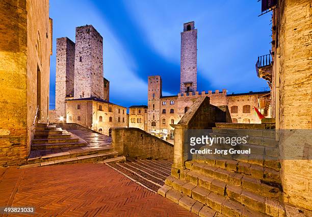piazza del duomo at dusk - san gimignano stock pictures, royalty-free photos & images