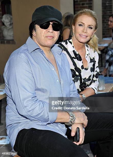 Musician Gene Simmons and Shannon Tweed attend the REVOLVE fashion show benefiting Stand Up To Cancer on October 22, 2015 in Los Angeles, California.