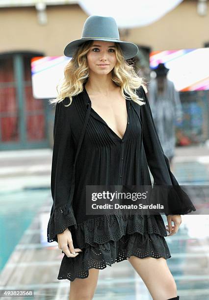 Model walks the runway at the REVOLVE fashion show benefiting Stand Up To Cancer on October 22, 2015 in Los Angeles, California.