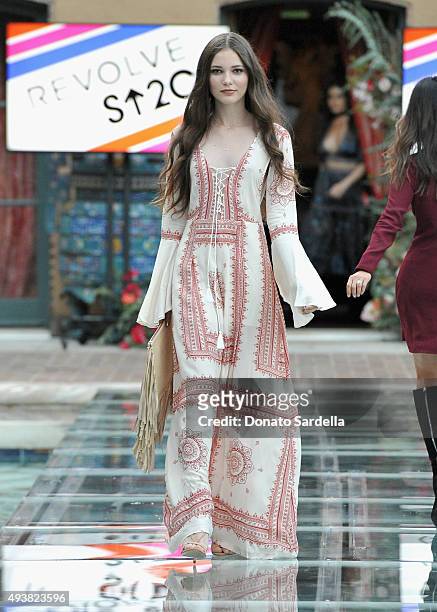 Model walks the runway at the REVOLVE fashion show benefiting Stand Up To Cancer on October 22, 2015 in Los Angeles, California.